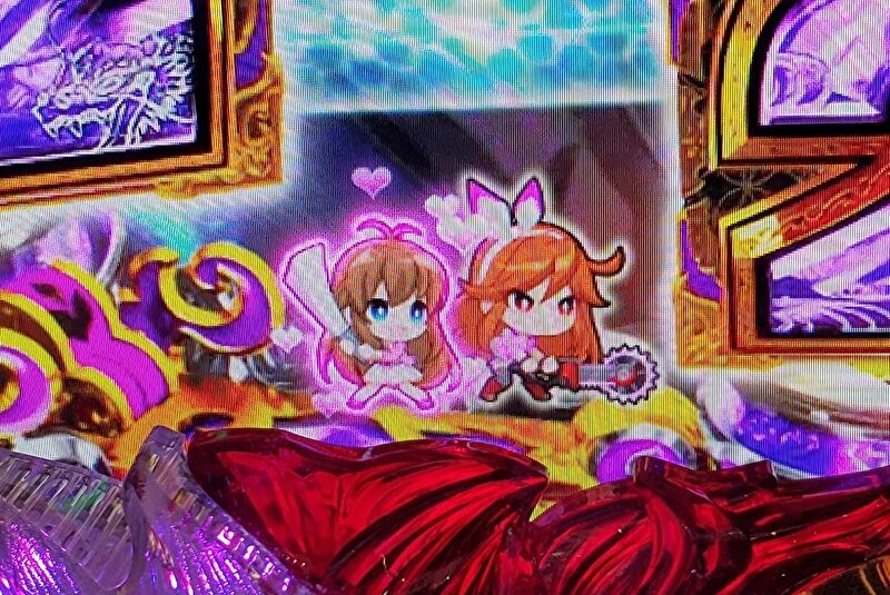 パチンコの演出画面に登場するデフォルメキャラの女の子2人がハートを出しているシーン